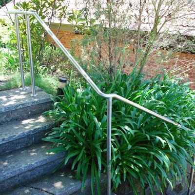 Stainless steel handrail installed on garden steps